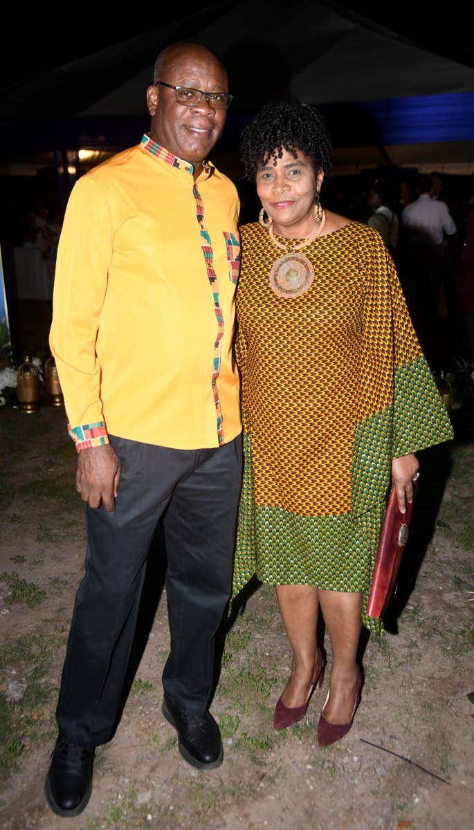 Leighton McKnight, former territory leader at PwC Jamaica, complements his wife, Dr Novelette McKnight, in coordinating African print.