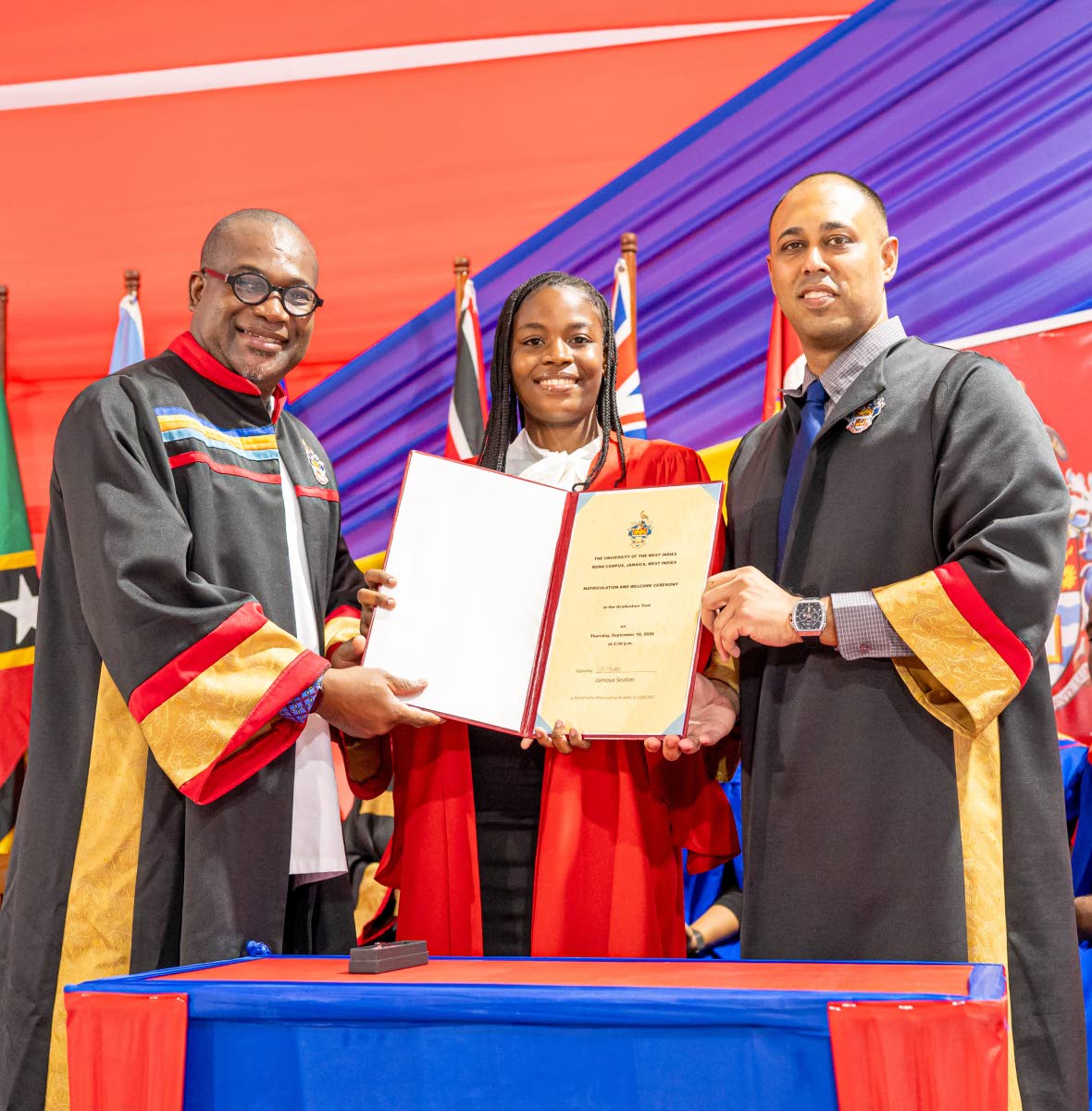 Jamoya Seaton, The University of the West Indies (UWI), Mona’s top matriculant for 2026, is flanked by Principal Densil A. Williams (left) and Deputy Campus Registrar Jonathan Archie at the campus’ Matriculation and Welcome Ceremony last month.
