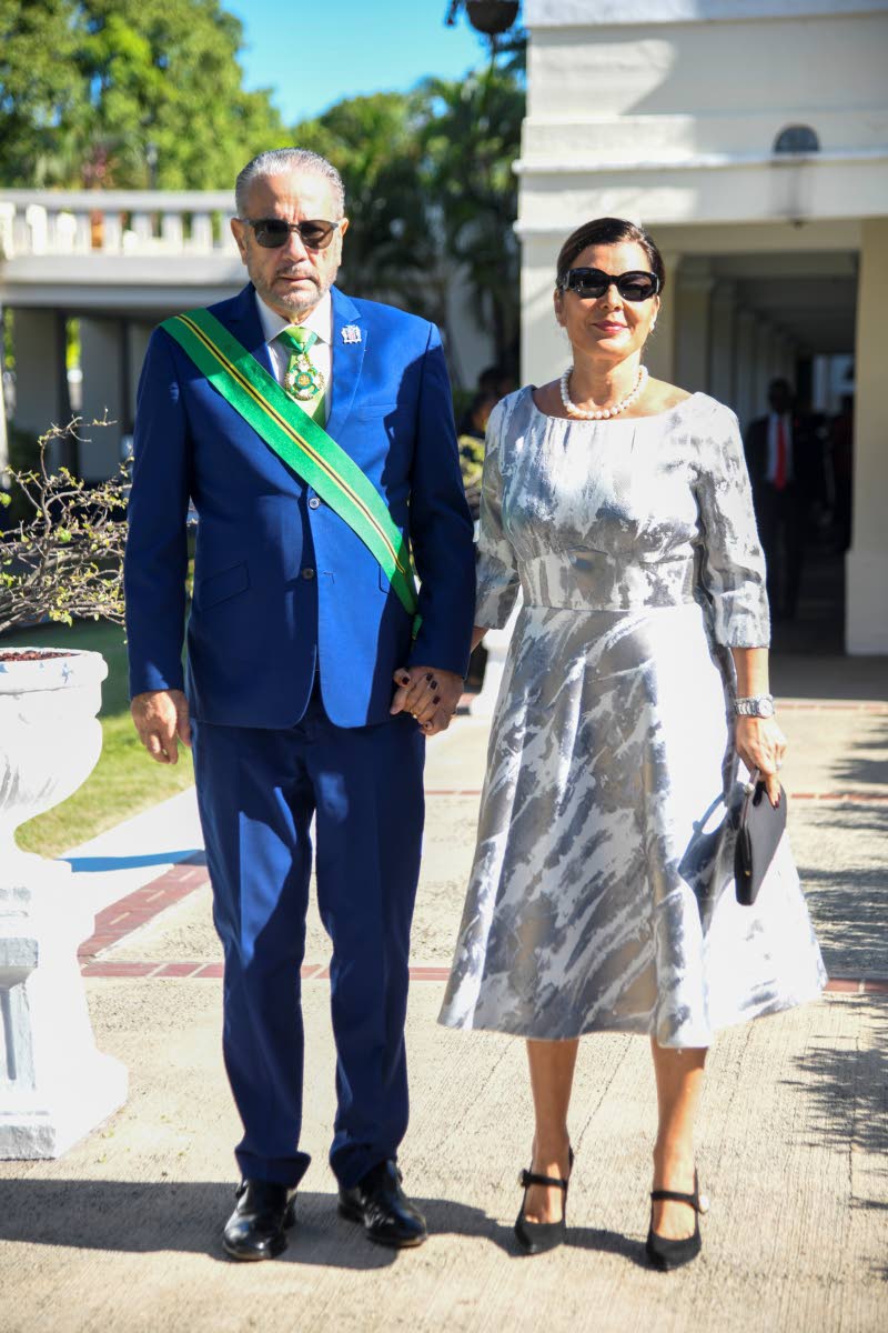 President of the Senate of Jamaica Tom Tavares-Finson and his wife, Rose, walk hand in hand as they pose for the lens.