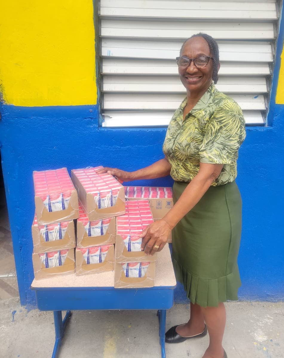Mildred Myers Isaacs, teacher at Galilee Early Childhood Development Centre in Kingston, proudly showcases the first delivery of Nutri+ Milk. The school is set to receive 2,400 units of milk throughout the 2026/2027 academic year.