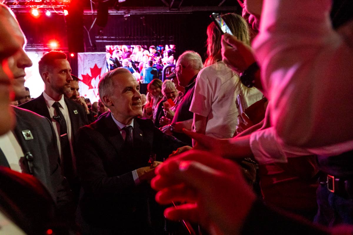 Canada’s Prime Minister Mark Carney, center, greets people at a Forever Canadian rally in Edmonton, on Friday, Oct. 16, 2026. 