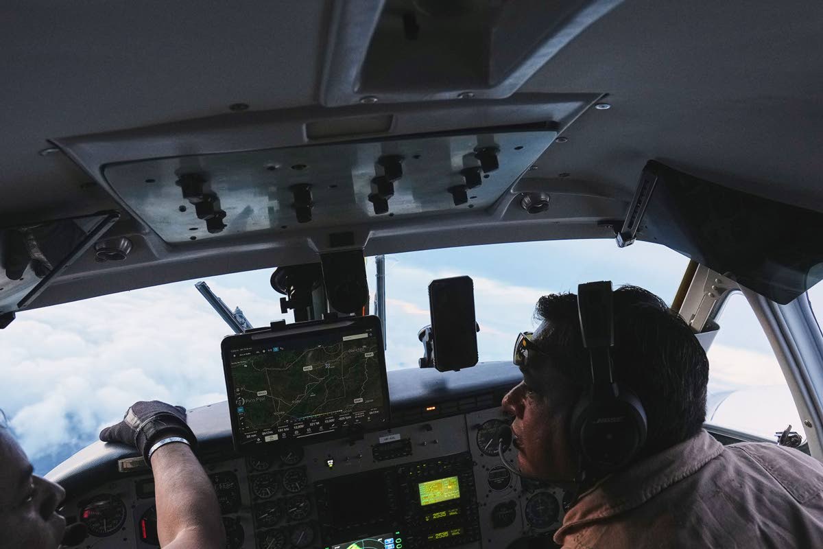Pilots Victor Torres from Mexico (right) and Jose Torres from Honduras fly an aircraft during a cloud seeding mission aimed at inducing rain as part of the Honduran government’s efforts to address a prolonged drought at the Aguan river, in northern Hondu