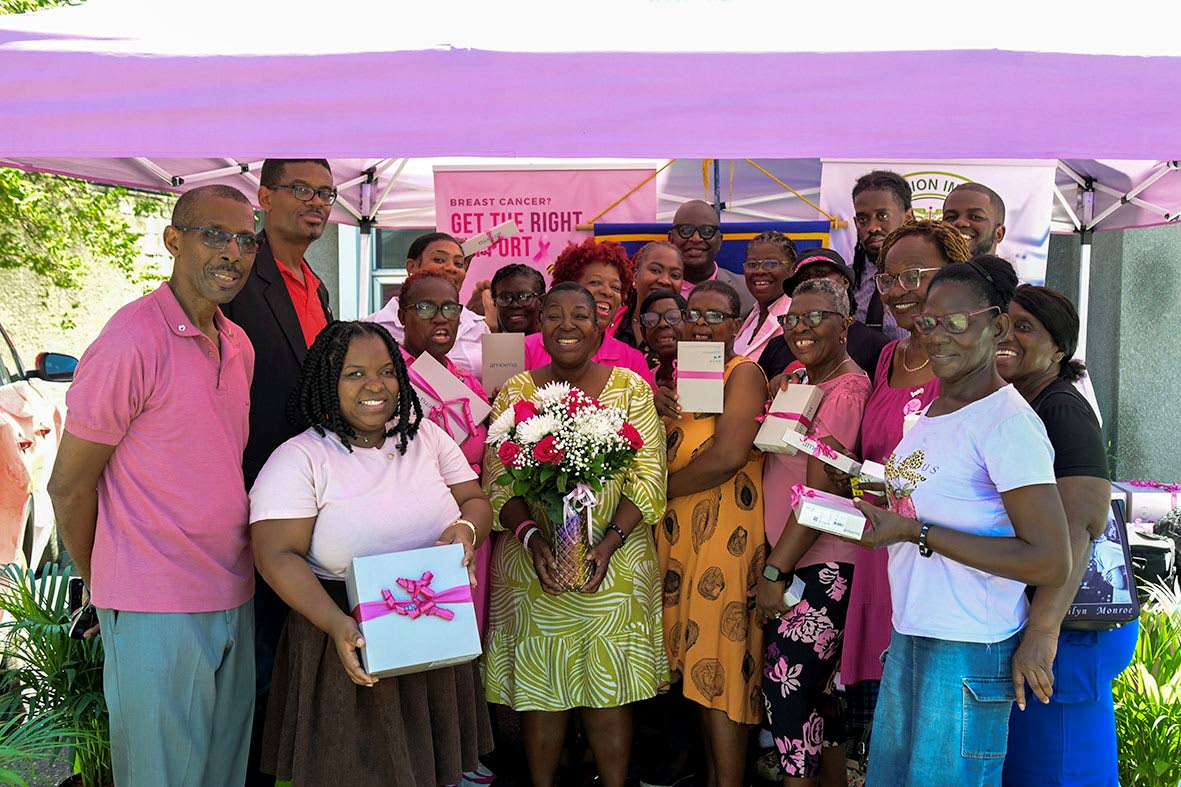 Representatives of the Rotary Club of Downtown Kingston, Precision Imaging Centre and Jamaica Reach To Recovery join breast-cancer survivors following the handover of breast prostheses and specialised mastectomy bras.