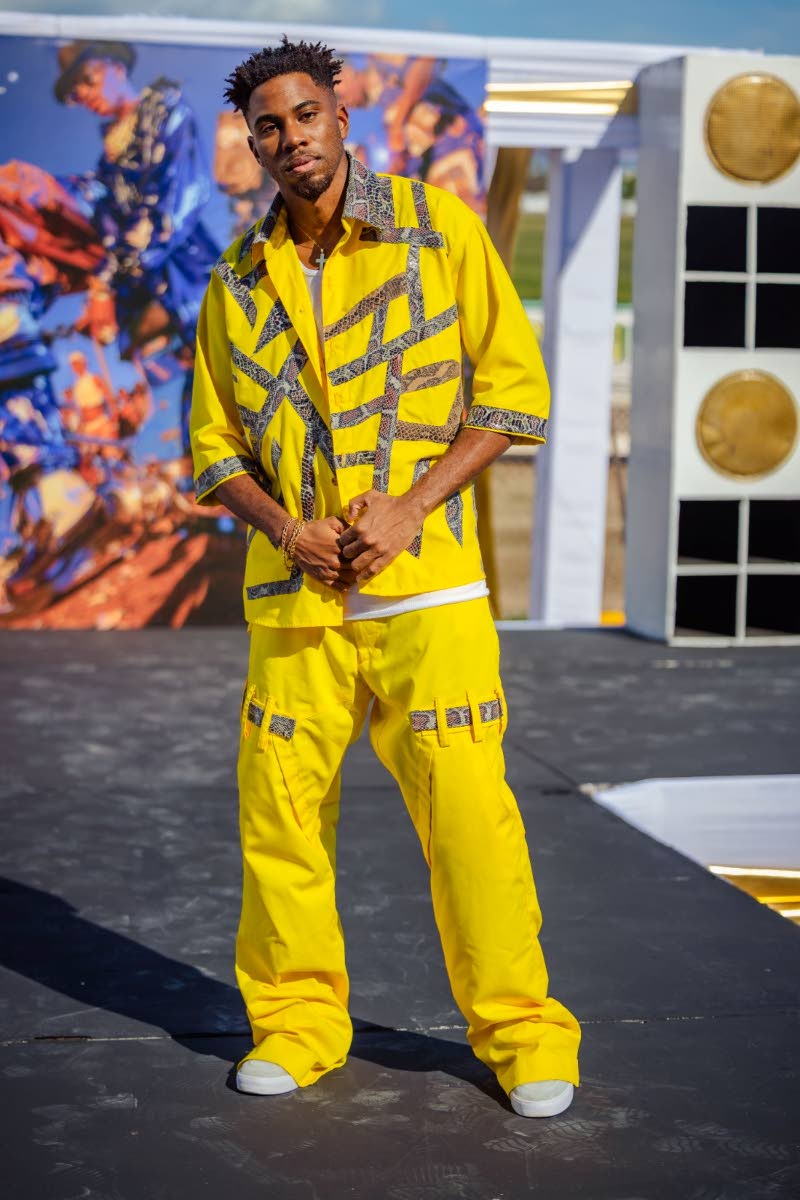 Djavan Warner pops in a bright yellow twill and spandex piece, accentuated by snakeskin. 