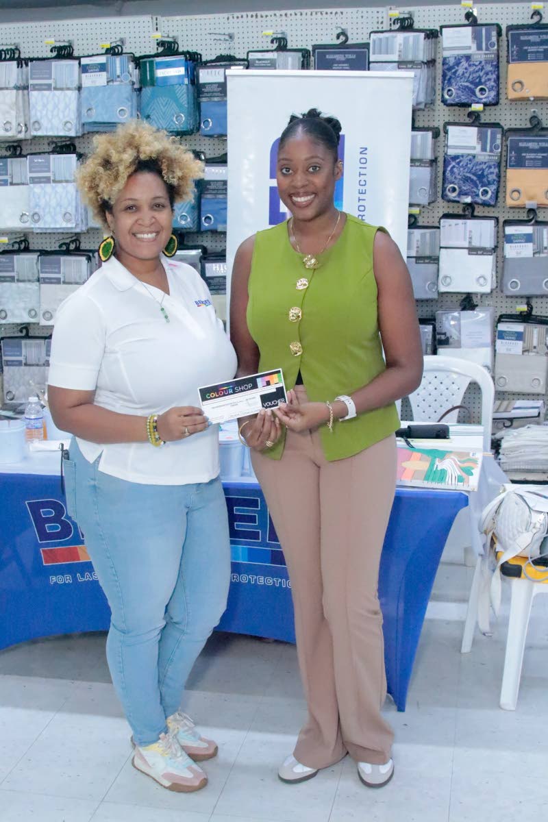 Jody-Ann Jones (left), area sales manager at Berger Paints Jamaica, presents Lee-Anne Jones with a gift voucher for her participation in a recent painting exercise at H&L Rapid True Value on Constant Spring Road in St Andrew.
