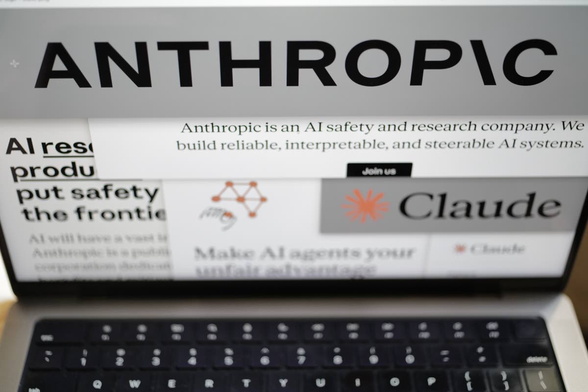 Pages from the Anthropic website and the company’s logos are displayed on a computer screen in February. 