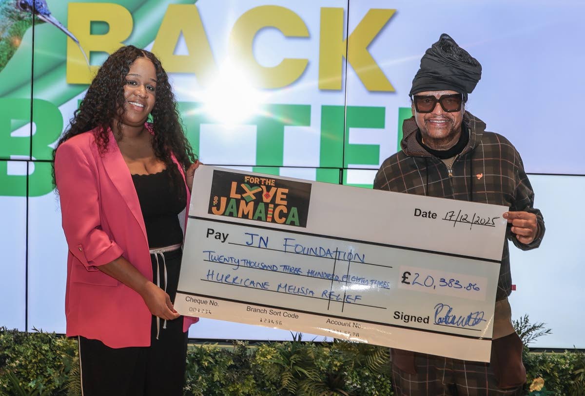 Music executive Portia Clarke-Mellanaise and reggae and R&B star, Maxi Priest, display a symbolic cheque made out to the JN Foundation to assist in its Hurricane Melissa relief efforts. The presentation was made in London, December 2025. The funds were rai
