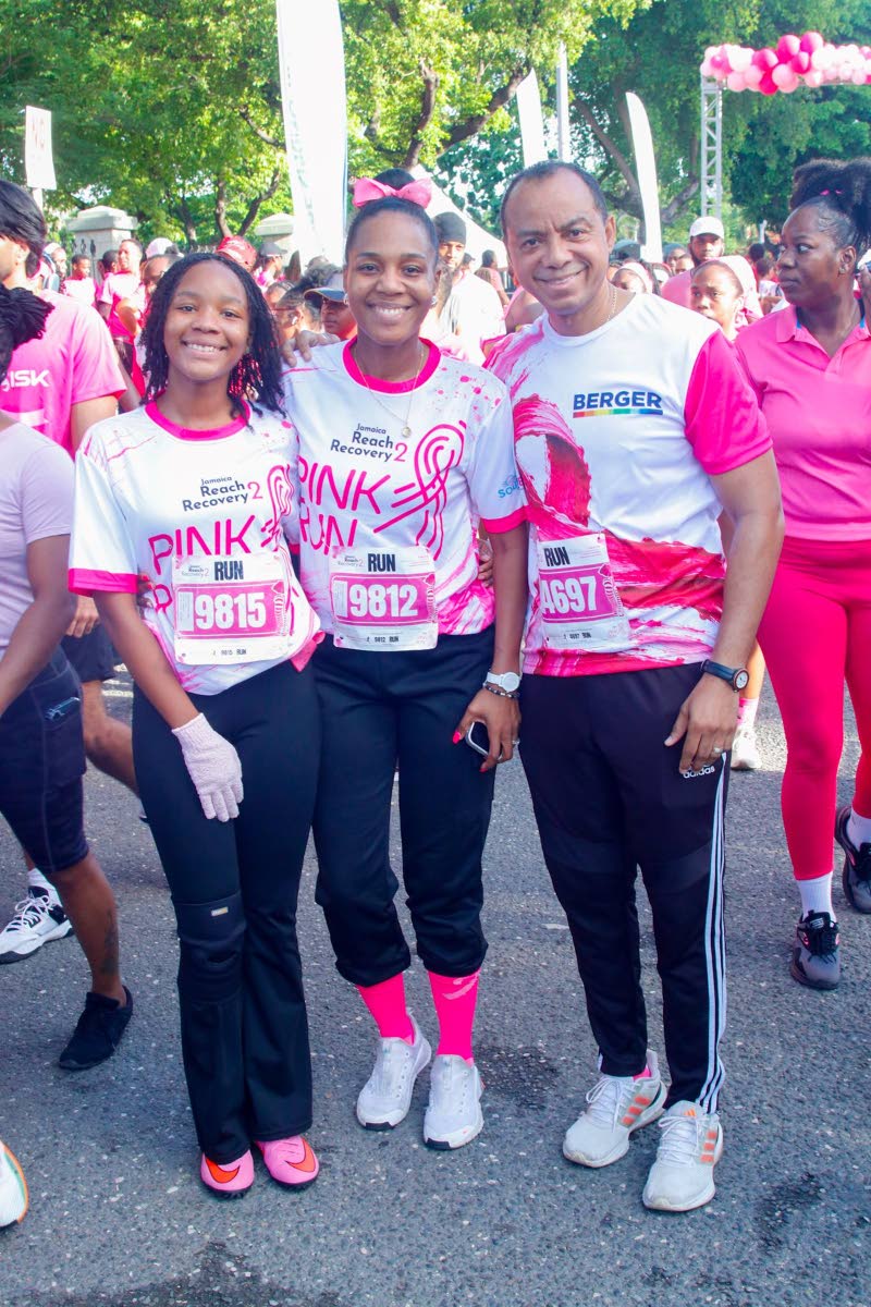 Media personality and author Dr Terri-Karelle Johnson (centre) poses with her daughter, Naima-Kourtnae Reid, and Osville Linton Johnson, general manager of Berger Paints Jamaica Limited.