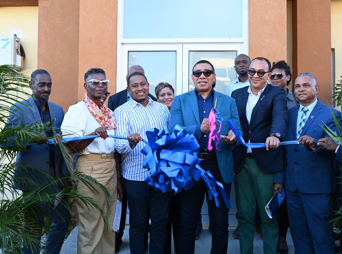 Prime Minister Dr Andrew Holness (centre) participates in a ribbon-cutting with government ministers and hospital officials during the reopening of the Black River Hospital in St Elizabeth yesterday.