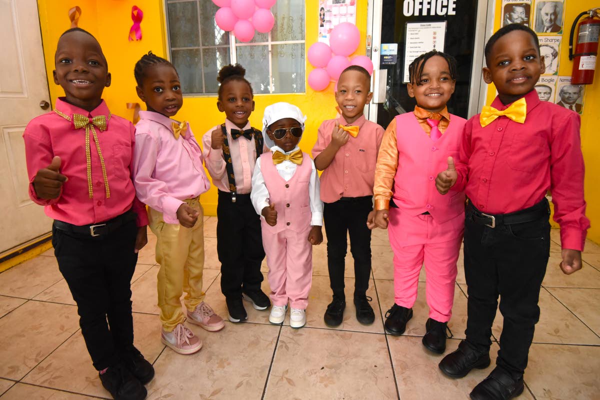 Some of the male students at the Gifted Minds Kindergarten in Kingston, dressed in pink and gold on October 23 to help raise funds for the fight against breast cancer and childhood cancer. They are from left: Ivan Brown, Javier Sylvester, Kaizer Crosdale, 