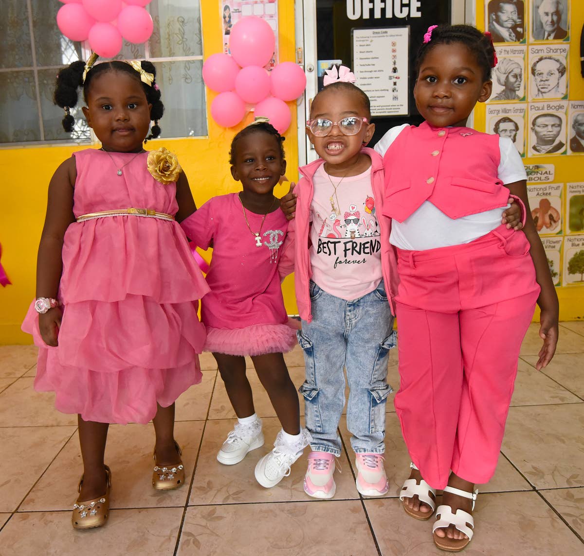 Some of the female students at the Gifted Minds Kindergarten in Kingston who dressed in pink and gold on October 23 to help raise funds for the fight against breast cancer and childhood cancer.  They are, from left: Sandrena Moncrieffe, Asha-Rose Osang, On