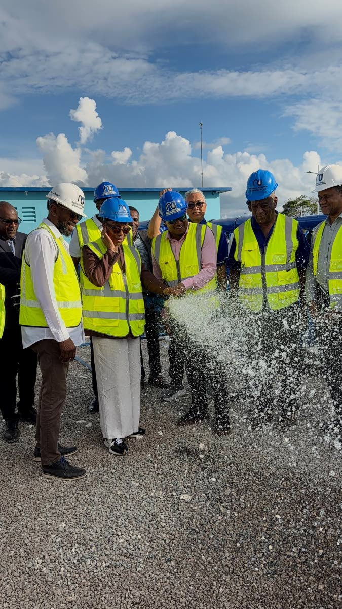 British High Commissioner Alicia Herbert and Agriculture Minister Floyd Green alongside other officials at Thursday’s commissioning of the Amity Hall/Bridge Pen Agro Park and irrigation system.