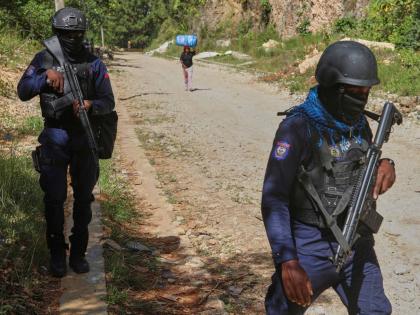 Police officers patrol the area near the Saint-Helene orphanage in the Kenscoff neighbourhood of Port-au-Prince, Haiti, Monday, August 4, 2025. (AP Photo/Odelyn Joseph)
