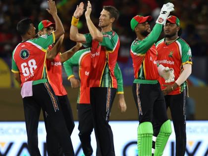 Guyana Amazon Warriors players celebrate.