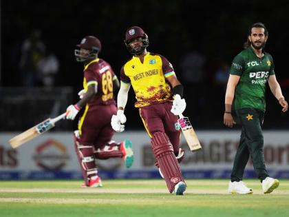 West Indies’ Shai Hope (centre) runs between the wickets with Sherfane Rutherford (left) during the second Twenty20 cricket match against Pakistan on August 2.