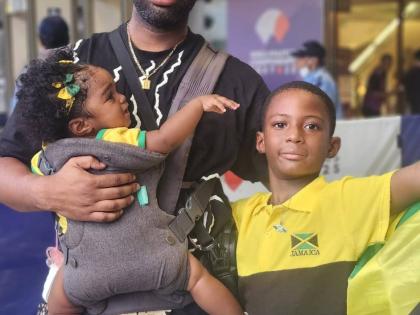 Chanise Henry’s husband, Shaka Henry, son Machel Shepherd and daughter, Zariya Avery at the Japan National Stadium on Snday.