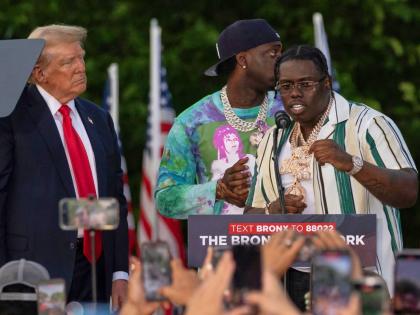 Rapper Sheff G (right), given name Michael Williams, joins then Republican presidential candidate Donald Trump during a campaign rally in the Bronx borough of New York on May 23, 2024.