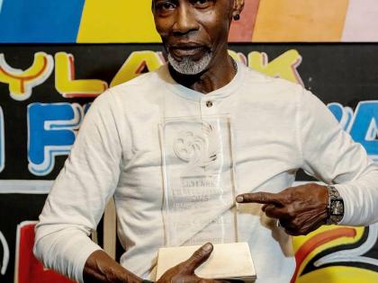 Veteran actor Paul Campbell poses for the camera after receiving the first-ever Skylark Film Festival Lifetime Achievement Award on Friday.