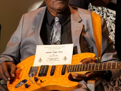 Radcliffe ‘Dougie’ Bryan with his guitar at the 2024 Grammy Certificate Ceremony, Florida, last July.