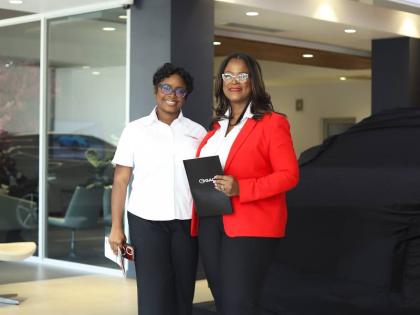 Ms Anna-Kaye Wright, Marketing Officer (left) and Mrs. Deborah Stewart, General Manager (right) of Fidelity Motors Limited pose for a photograph at the recent GAC vehicle launch.