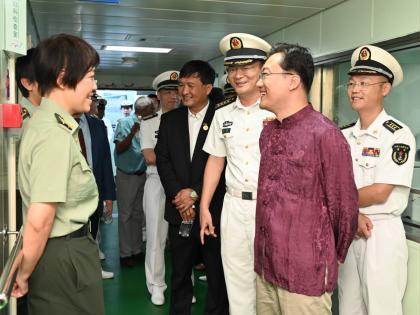 Ambassador of the People’s Republic of China to Jamaica, Wang Jinfeng (second right), greets crew members of the ‘Ark Silk Road; medical ship at the Montego Bay Cruise Ship Terminal on Thursday.