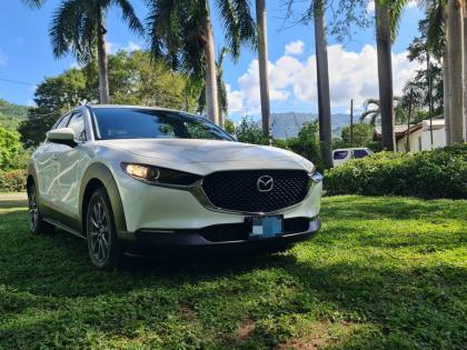 The elegant sweep of the Kodo design language is perfectly captured in this front three-quarter view, highlighting the slender LED headlamps and bold grille signature.