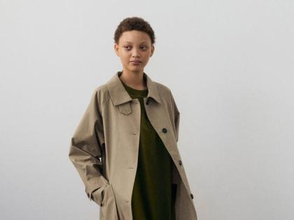 The MHL Railway Mac dry cotton canvas raincoat is teamed with a relaxed T-shirt dress. 