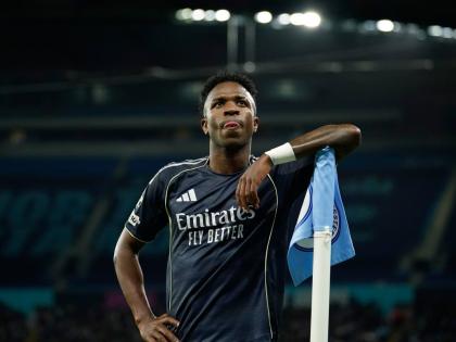 Real Madrid’s scorer Vinicius Junior reacts at the corner flag after scoring the opening goal from the penalty spot during the Champions League round-of-16 second-leg football match against Manchester City in Manchester, yesterday.