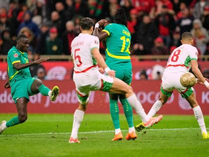 Senegal’s Pape Gueye (left) scores the opening goal during the Africa Cup of Nations final football match against Morocco, in Rabat, Morocco on January 18.