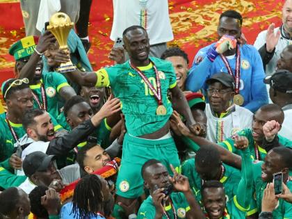 Senegal's Sadio Mane holds the trophy aloft as he celebrates with teammates after winning the Africa Cup of Nations final football match between Senegal and Morocco in Rabat, Morocco, Sunday, January18, 2026. (AP Photo/Youssef Loulidi, File)