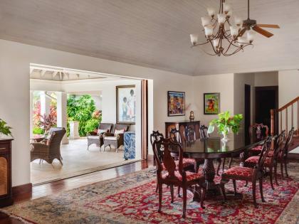 The dining room opens wide to covered outdoor dining and living rooms.