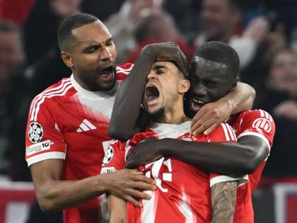Bayern Munich’s Luis Diaz (centre) celebrates with Dayot Upamecano (right) and Jonathan Tah after scoring his side’s third goal during the Champions League quarterfinal second leg football match against Real Madrid in Munich, Germany, yesterday.