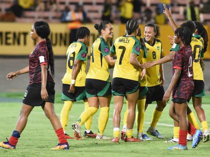 Jamaica’s Reggae Girlz celebrate after scoring their fourth goal against Antigua and Barbuda at the National Stadium on Friday, April 10.  Jamaica defeated Antigua and Barbuda 4-0.
