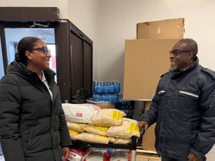 Broughton (left) in conversation with David Betty, president of the Jamaican Canadian Association in Ontario at a Hurricane Melissa donation relief drop-off centre last November. JN Bank in Canada served as the official drop-off for items collected in Toro