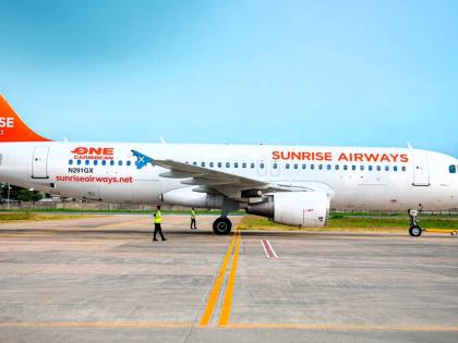 A Sunrise Airways aircraft sits on the tarmac.