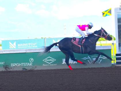 RIDEALLDAY, ridden by Ian Spence, wins the sixth running of the Ian Levy Cup in a track record 1:41:8 seconds at Caymanas Park on April 6.