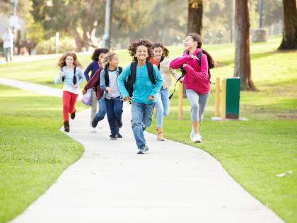 Representational image of children running in a park