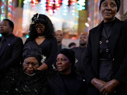 Esther Lungu, widow of Zambia’s former President Edgar Lungu (centre) and family members attend a Mass at the Cathedral of Christ the King in Johannesburg, South Africa, on June 25, 2025.