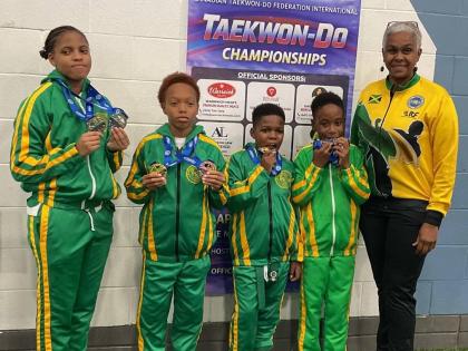 Jamaica’s juniors (from left) Abigail Dixon, Quinton Jackson, Romalachai Graham and Liam Laylor, show off their medals won at the 2026 North American and Caribbean International Taekwon-do Championship in Brampton, Canada. Master Joleen Masters (right) c