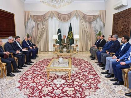 In this photo released by the Pakistan Prime Minister Office, Iran's Foreign Minister Abbas Araghchi, fifth left, meets with Prime Minister Shehbaz Sharif, center, in Islamabad, Pakistan on April 25, 2026. (Pakistan Prime Minister Office via AP)