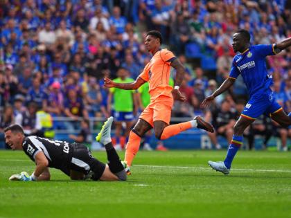 Barcelona's Marcus Rashford scores his side's 2nd goal during the Spanish La Liga football match between Getafe and Barcelona in Getafe, Spain on April 25, 2026. (AP Photo/Manu Fernandez)