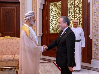 In this photo released by the Iranian Foreign Ministry, Iranian Foreign Minister Abbas Araghchi, right, shakes hands with Oman's Sultan Haitham bin Tariq during their meeting, in Muscat, Oman on April 26, 2026. (Iranian Foreign Ministry via AP)
