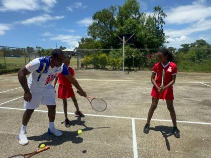 Tennis player Kevin Simms shows Broughton Primary students the basics of tennis, as they eagerly take to the court during the programme’s launch.