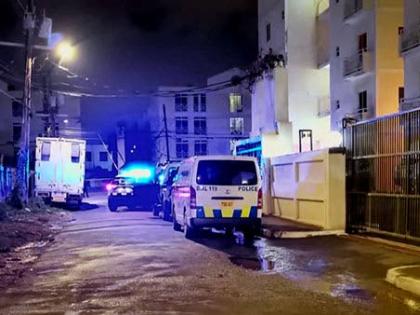 The police on the crime scene in the vicinity of Kensington Court in New Kingston on Friday night.