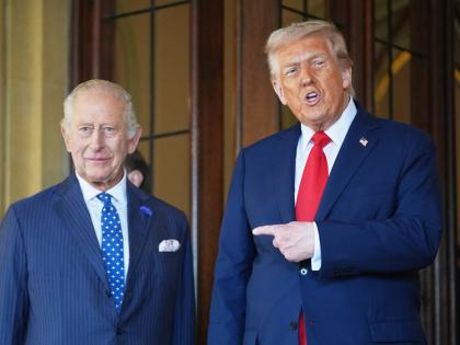 FILE - President Donald Trump gestures next to Britain's King Charles III before leaving Windsor Castle, Windsor, England, Sept. 18, 2025. (AP Photo/Evan Vucci, file)