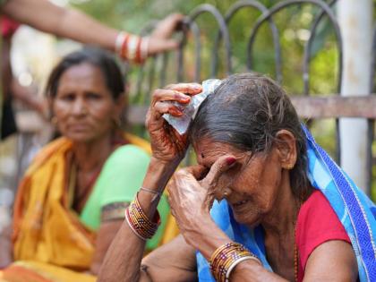 A woman cools herself off with an ice pack during a heat wave in Banda, northern Indian state of Uttar Pradesh.