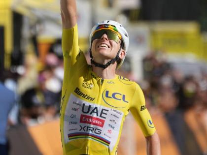 AP 
Slovenia’s Tadej Pogacar, wearing the overall leader’s yellow jersey, crosses the finish line to win the 19th stage of the Tour de France cycling race with start in Gap and finish in Alpe d’Huez, France on Friday.