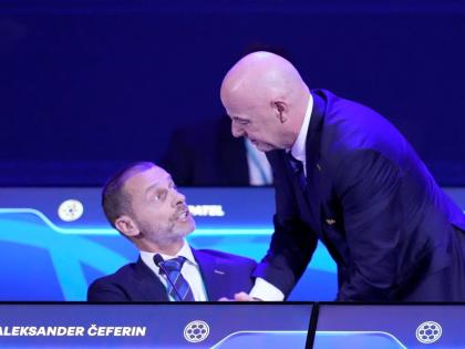 FIFA President Gianni Infantino (right) talks to UEFA President Aleksander Ceferin during the FIFA 75th Congress at the Conmebol Convention Center in Luque, Paraguay, Thursday, May 15, 2025. 