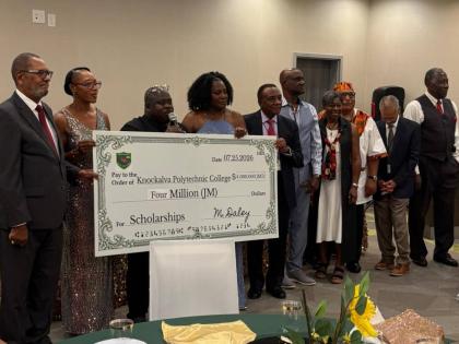 Displaying a $4-million symbolic cheque from the Knockalva International Alumni Association (KIAA) for scholarships to students at Knockalva Polytechnic College (KPC) in Hanover are (from left) L. Anthony Lawrence, chairman of the KPC board; Principal Nata