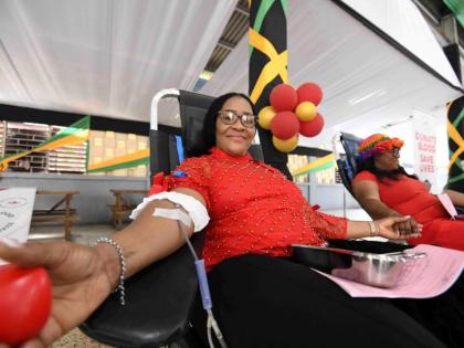 Sonya Binns-Lawrence, Jamaica’s top female blood donor, gives blood during her birthday blood drive, held on the grounds of Kencot Seventh-day Adventist Church in Kingston last February. 